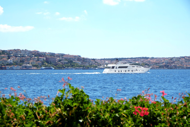 Beautiful view of sea, boat and blue sky on sunny day Photo of Beautiful view of sea, boat and blue sky on sunny day