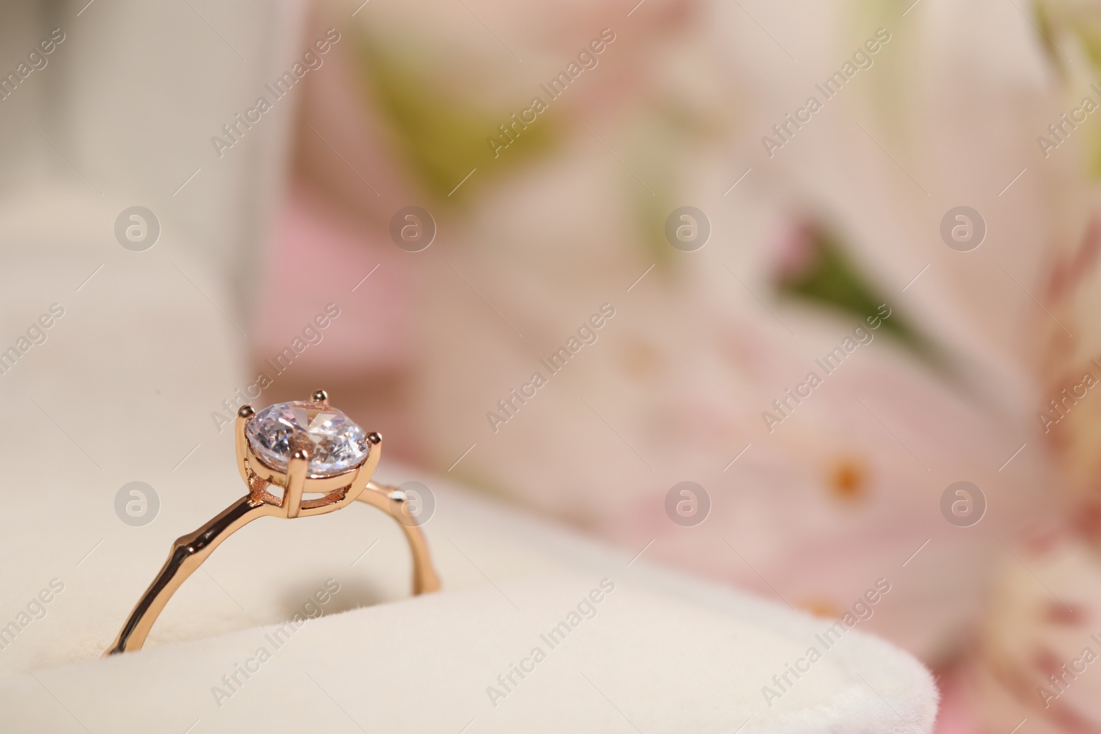 Beautiful engagement ring with gemstone in box on blurred background, closeup. Space for text Photo of Beautiful engagement ring with gemstone in box on blurred background, closeup. Space for text