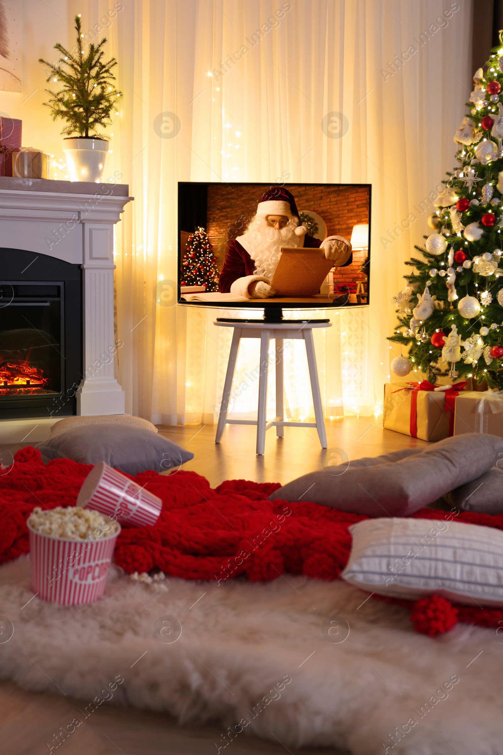 Stylish living room interior with TV set, Christmas tree and fireplace Image of Stylish living room interior with TV set, Christmas tree and fireplace