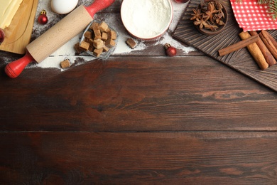 Flat lay composition with ingredients for traditional Christmas cake on wooden table. Space for text Photo of Flat lay composition with ingredients for traditional Christmas cake on wooden table. Space for text