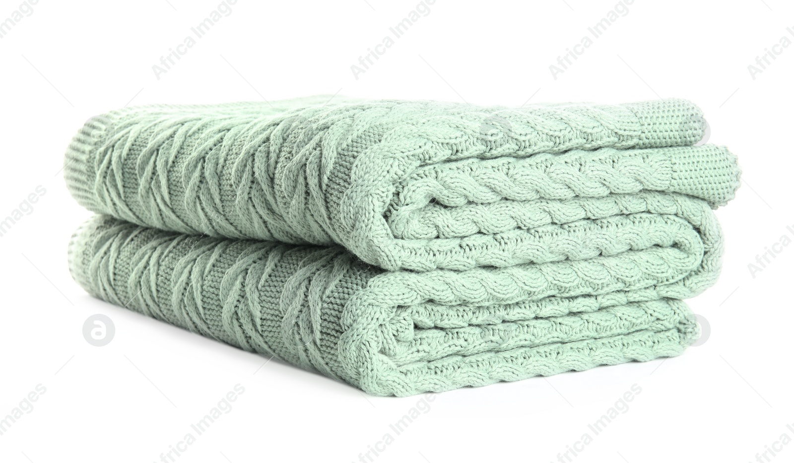 Stylish light knitted plaid on white background Photo of Stylish light knitted plaid on white background