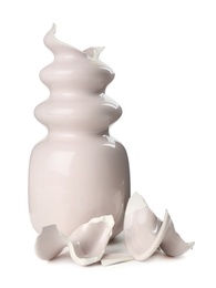 Broken pink ceramic vase isolated on white Photo of Broken pink ceramic vase isolated on white