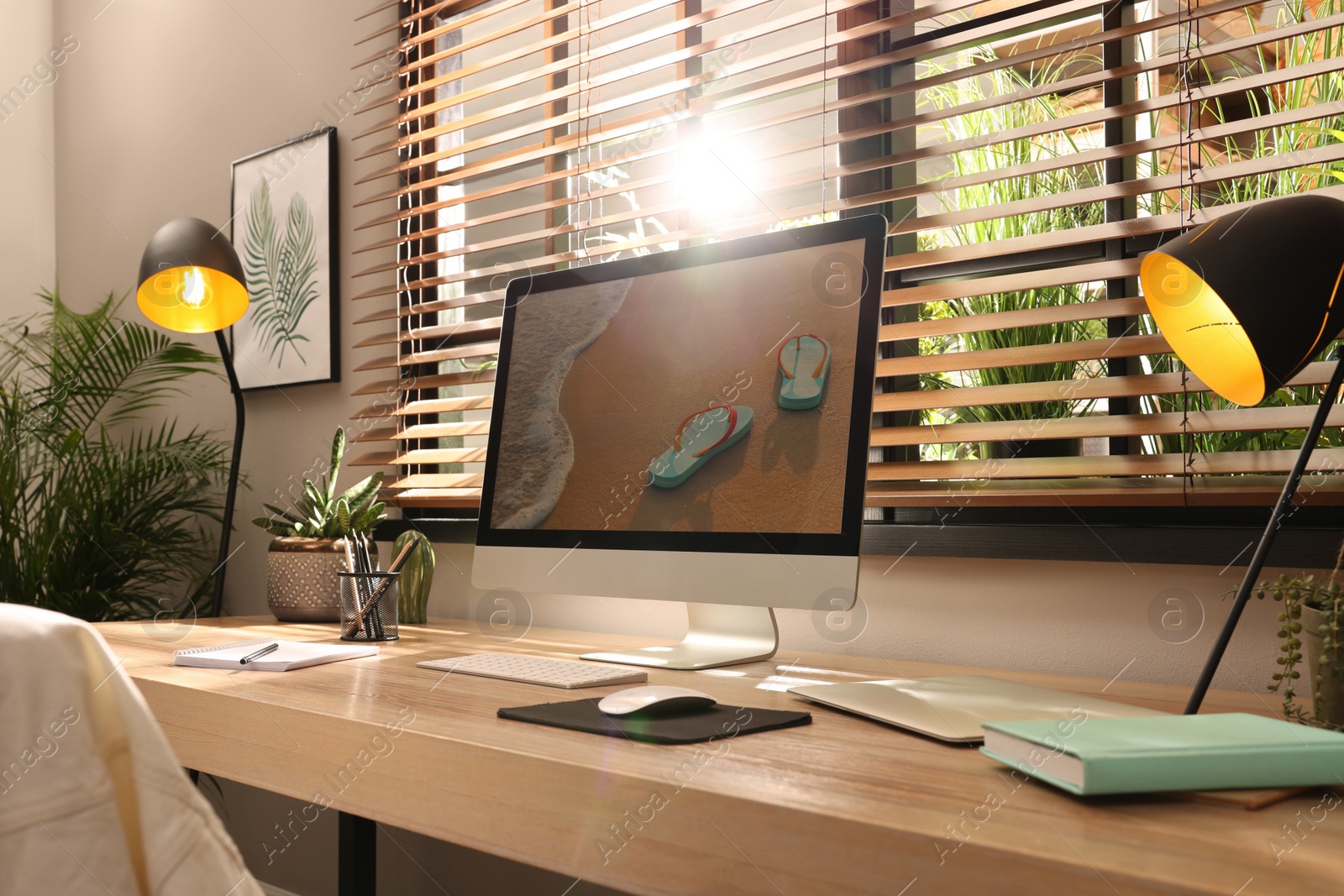 Comfortable workplace near window in room. Interior design Photo of Comfortable workplace near window in room. Interior design