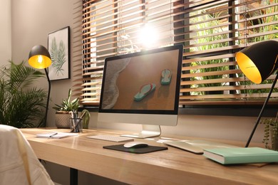 Comfortable workplace near window in room. Interior design Photo of Comfortable workplace near window in room. Interior design