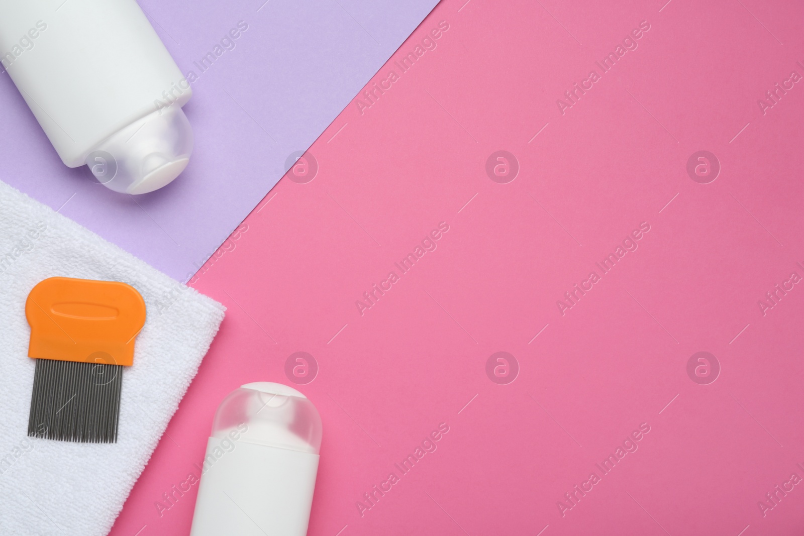 Anti lice products in bottles, comb and towel on color background, flat lay. Space for text Photo of Anti lice products in bottles, comb and towel on color background, flat lay. Space for text