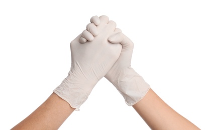 Doctors in medical gloves shaking hands on white background, closeup Photo of Doctors in medical gloves shaking hands on white background, closeup
