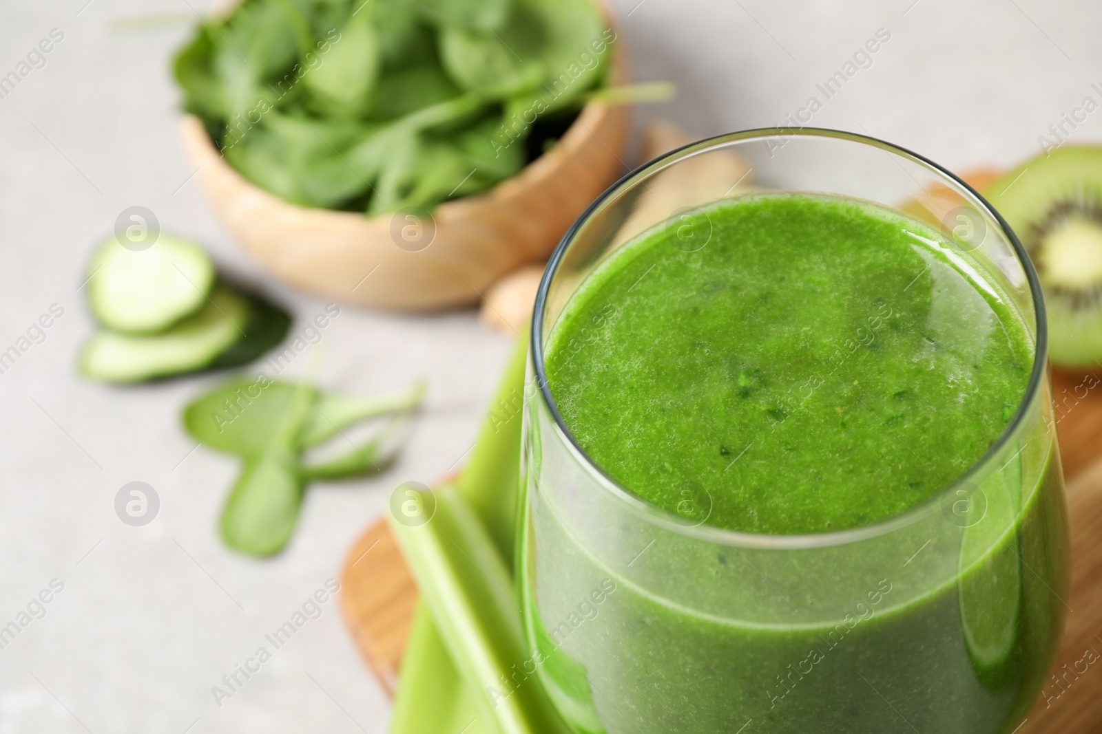 Delicious fresh green juice in glass, closeup. Space for text Photo of Delicious fresh green juice in glass, closeup. Space for text