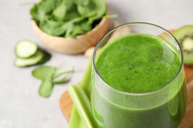Delicious fresh green juice in glass, closeup. Space for text Photo of Delicious fresh green juice in glass, closeup. Space for text
