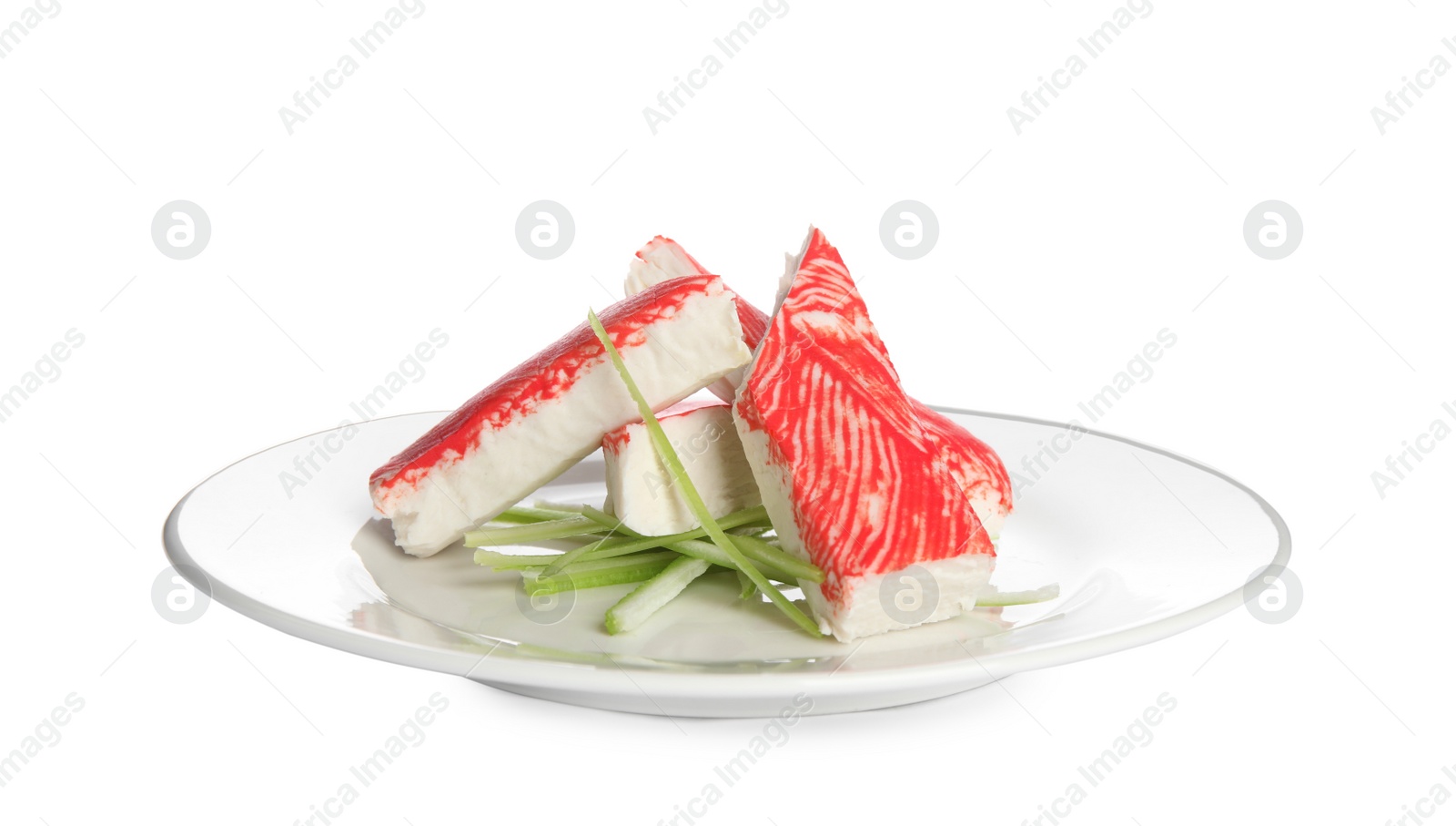 Plate with fresh crab sticks and cucumber isolated on white Photo of Plate with fresh crab sticks and cucumber isolated on white