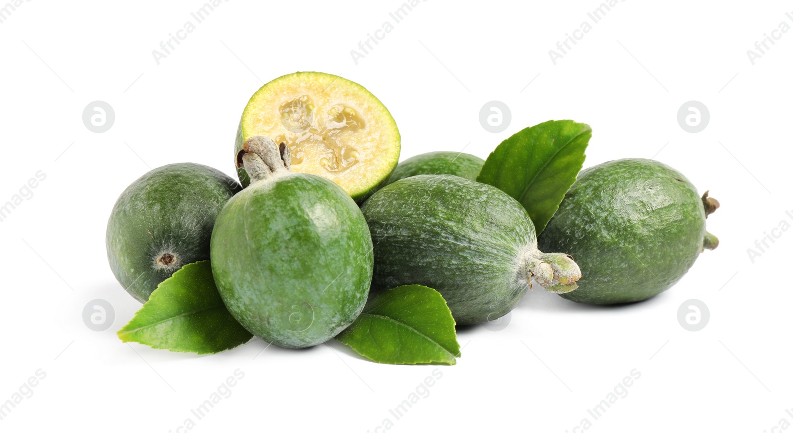 Pile of feijoas and leaves on white background Photo of Pile of feijoas and leaves on white background