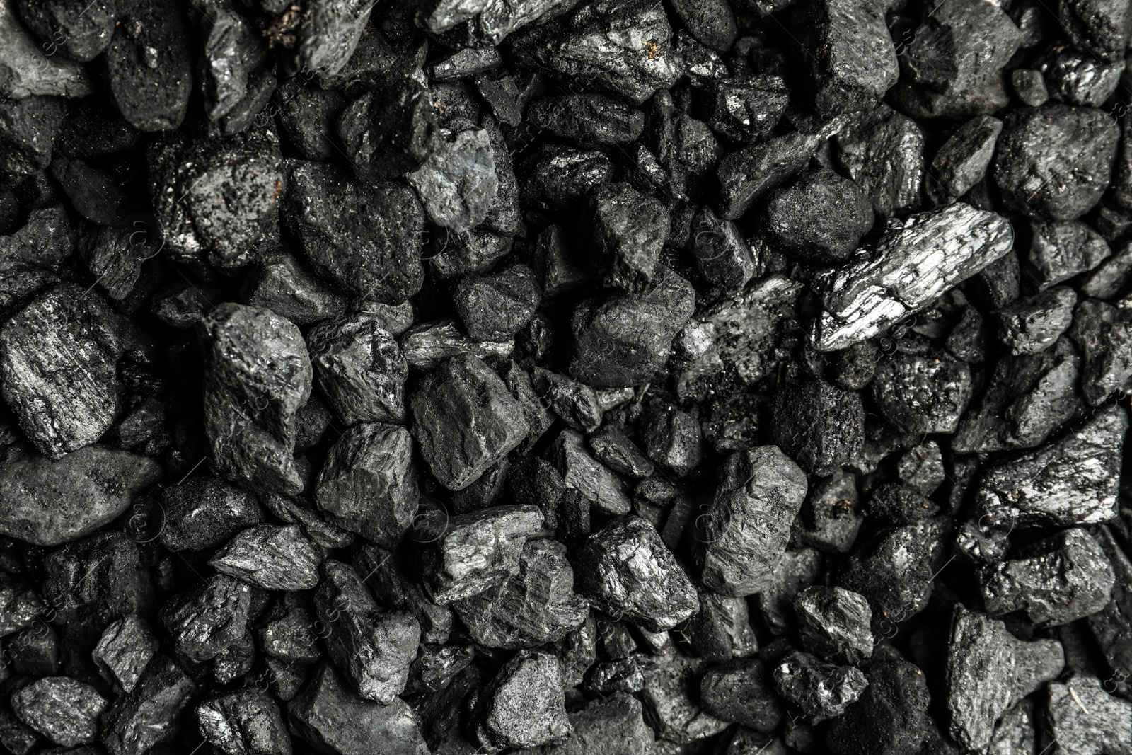Heap of coal as background, top view Photo of Heap of coal as background, top view