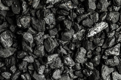Heap of coal as background, top view Photo of Heap of coal as background, top view