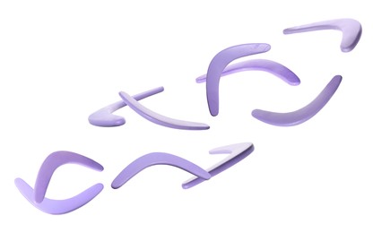 Many violet boomerangs flying on white background Image of Many violet boomerangs flying on white background