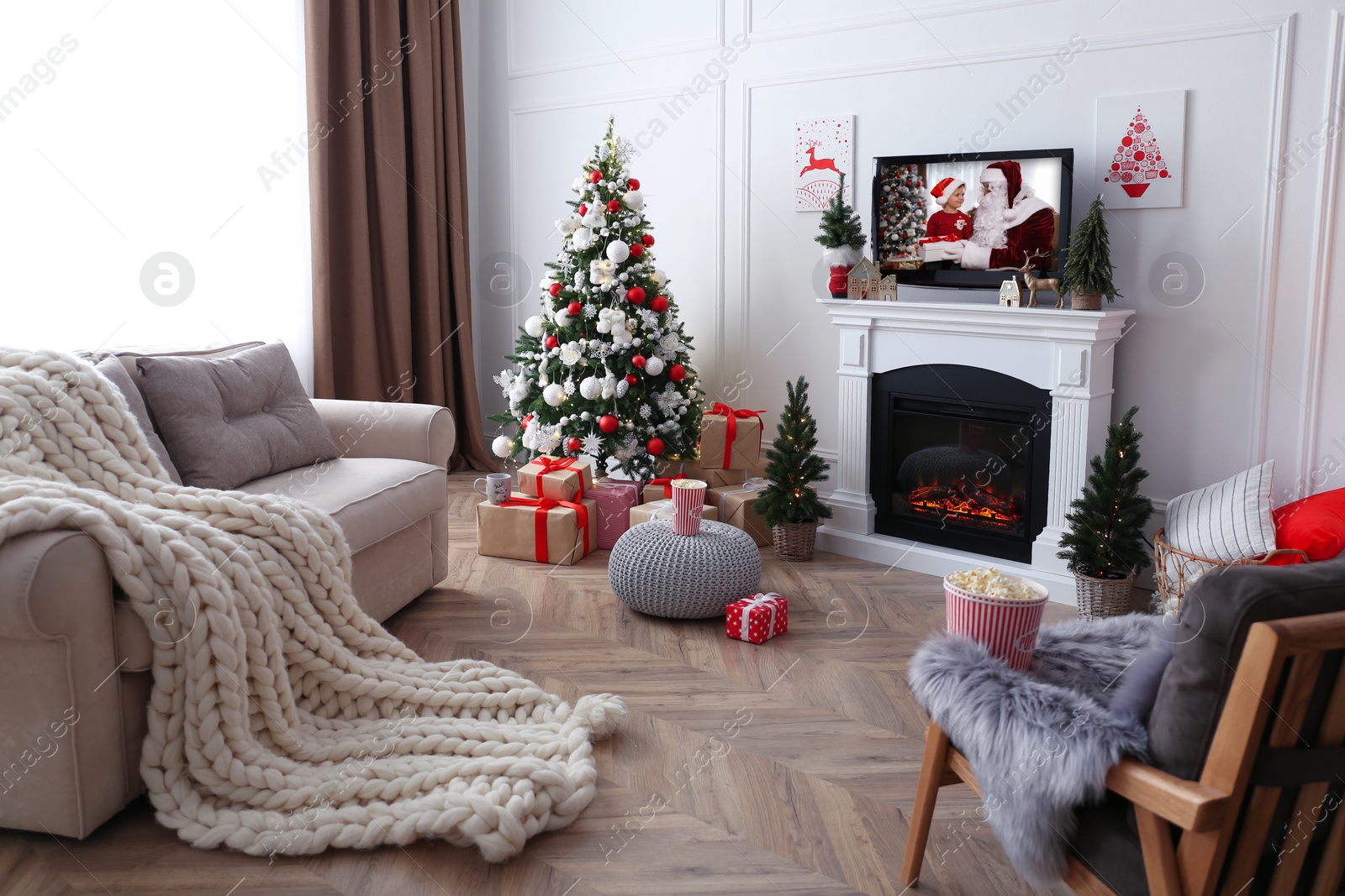 Stylish living room interior with TV set, Christmas tree and fireplace Image of Stylish living room interior with TV set, Christmas tree and fireplace
