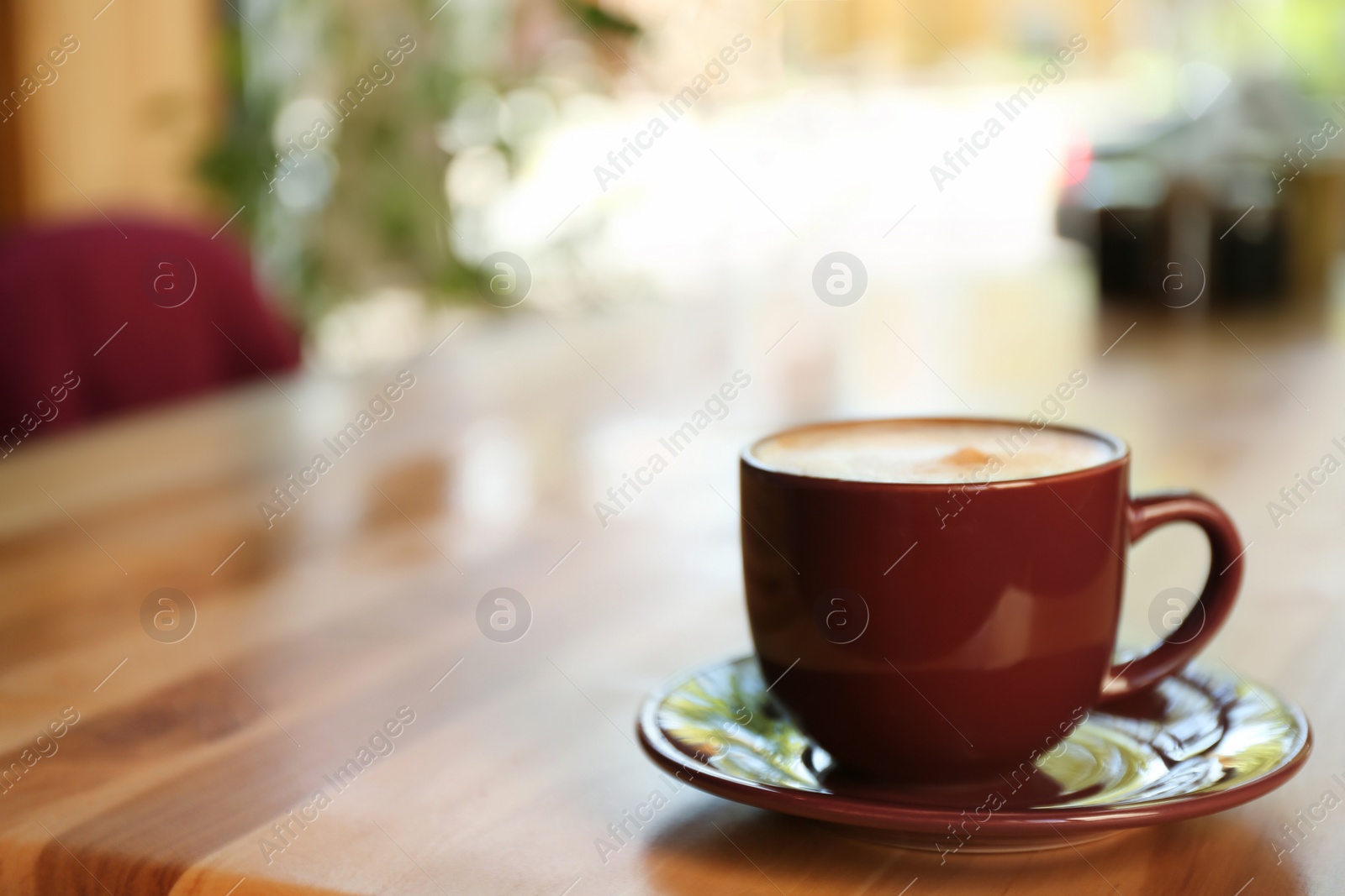 Aromatic coffee on wooden table in cafe. Space for text Photo of Aromatic coffee on wooden table in cafe. Space for text