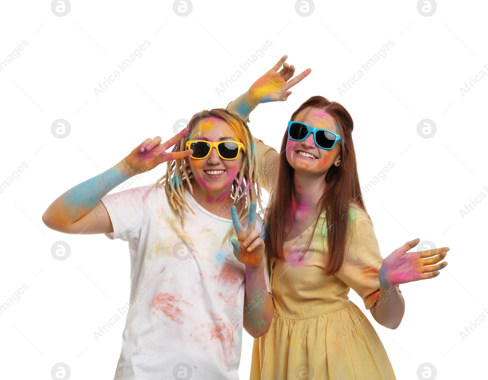 Women covered with colorful powder dyes on white background. Holi festival celebration Photo of Women covered with colorful powder dyes on white background. Holi festival celebration