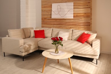 Modern comfortable sofa near wall in room. Interior design Photo of Modern comfortable sofa near wall in room. Interior design