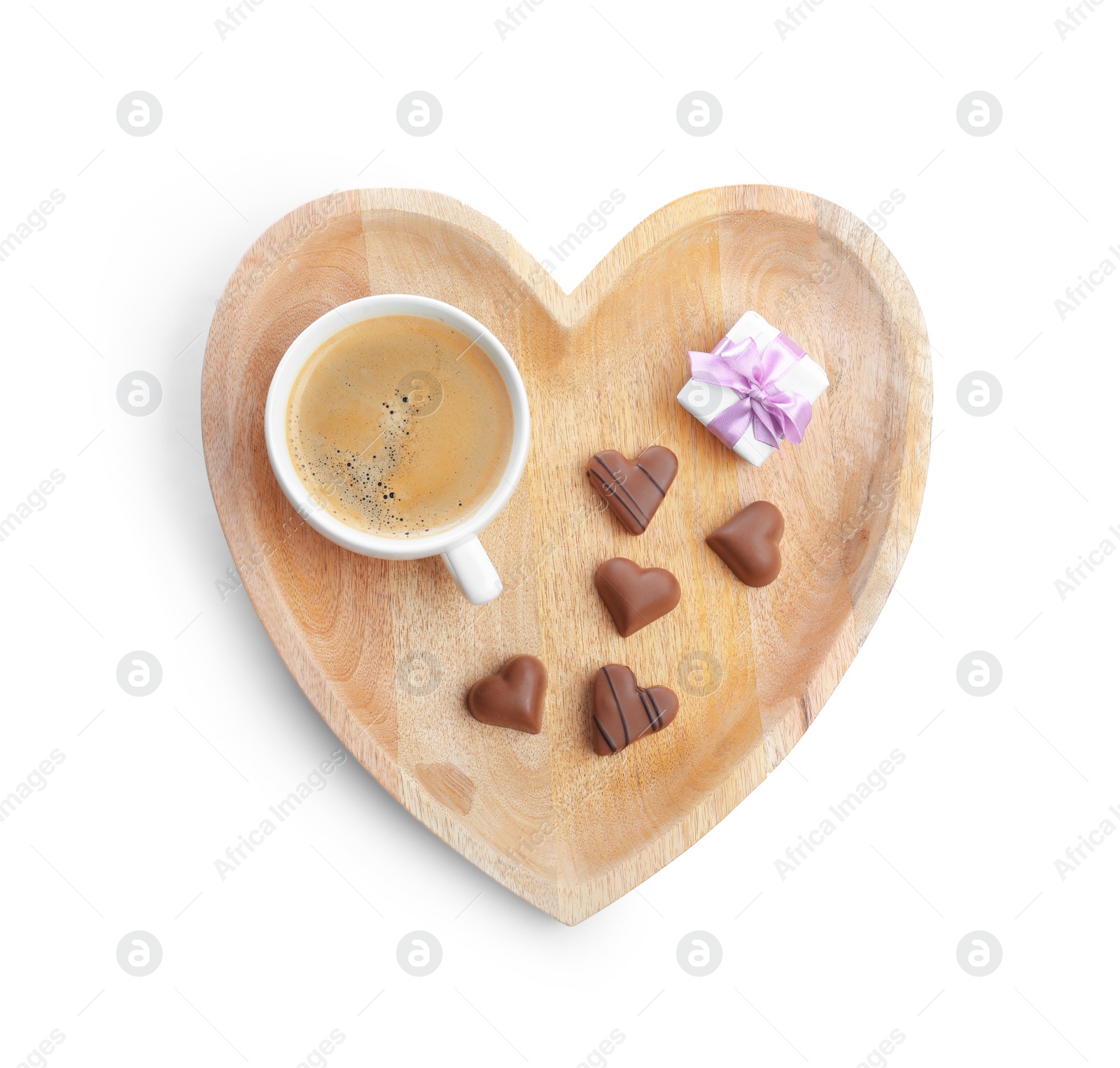 Romantic breakfast with cup of coffee, chocolate candies and gift box isolated on white, top view. Valentine's day celebration Photo of Romantic breakfast with cup of coffee, chocolate candies and gift box isolated on white, top view. Valentine's day celebration