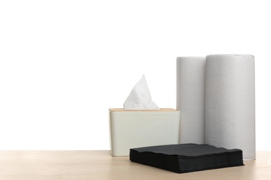 Different clean paper tissues on wooden table Photo of Different clean paper tissues on wooden table