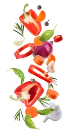 Set of different fresh vegetables and spices falling on white background Image of Set of different fresh vegetables and spices falling on white background
