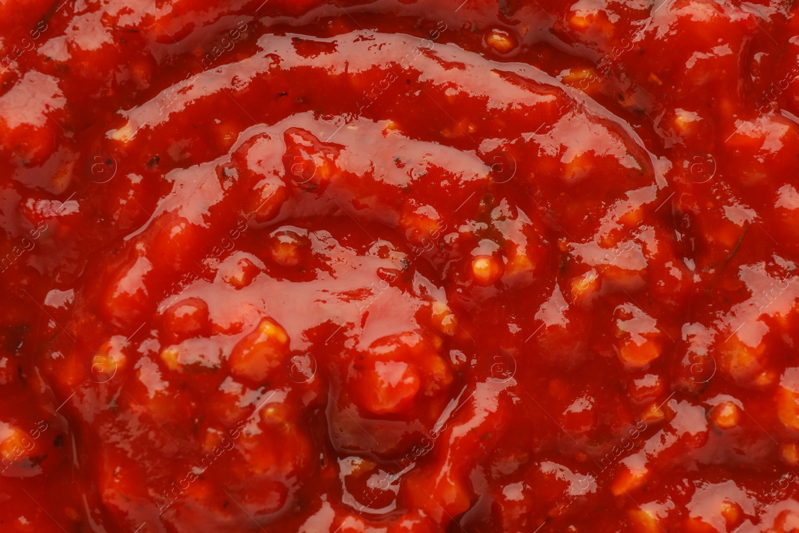 Texture of delicious adjika sauce as background, closeup Photo of Texture of delicious adjika sauce as background, closeup