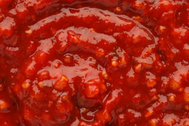 Texture of delicious adjika sauce as background, closeup Photo of Texture of delicious adjika sauce as background, closeup