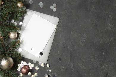 Flat lay composition with blank greeting card and Christmas decor on grey background, space for text Photo of Flat lay composition with blank greeting card and Christmas decor on grey background, space for text
