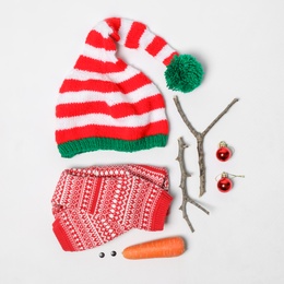 Set of materials for snowman on white background, flat lay Photo of Set of materials for snowman on white background, flat lay