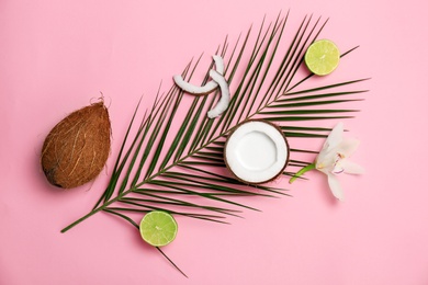 Composition with coconut milk and fresh nuts on color background, top view Photo of Composition with coconut milk and fresh nuts on color background, top view