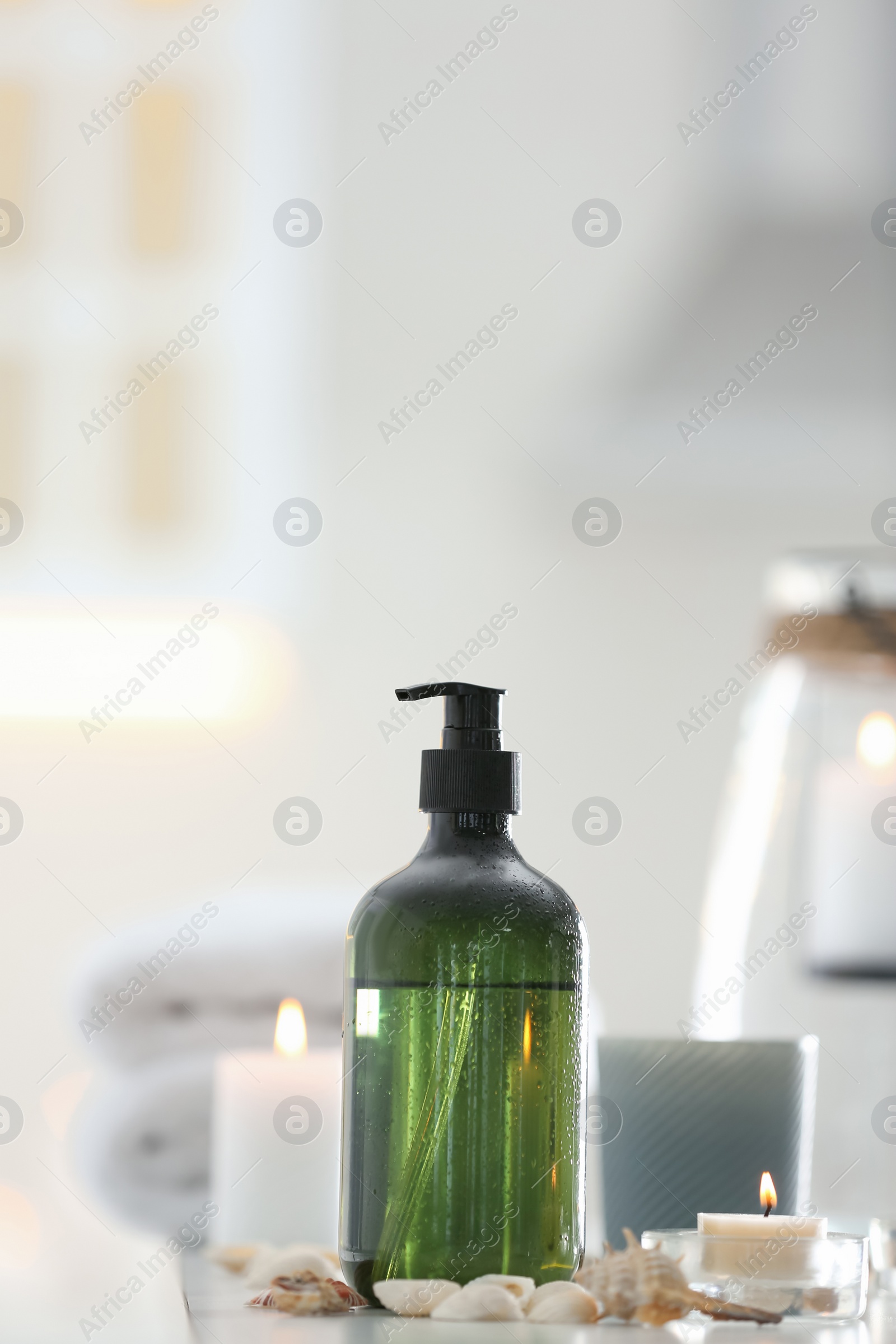 Soap dispenser and decor elements on table Photo of Soap dispenser and decor elements on table