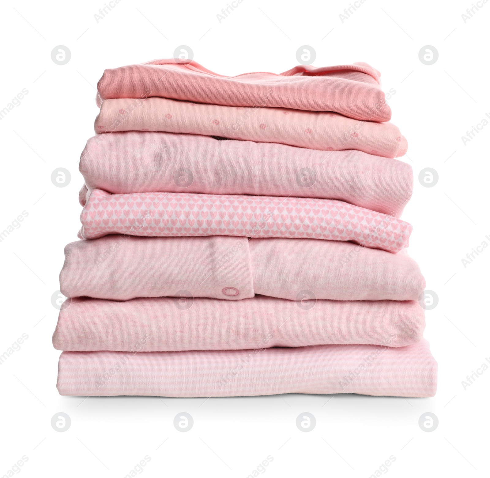 Stack of baby girl's clothes on white background Photo of Stack of baby girl's clothes on white background