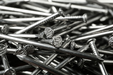 Pile of metal nails as background, closeup Photo of Pile of metal nails as background, closeup