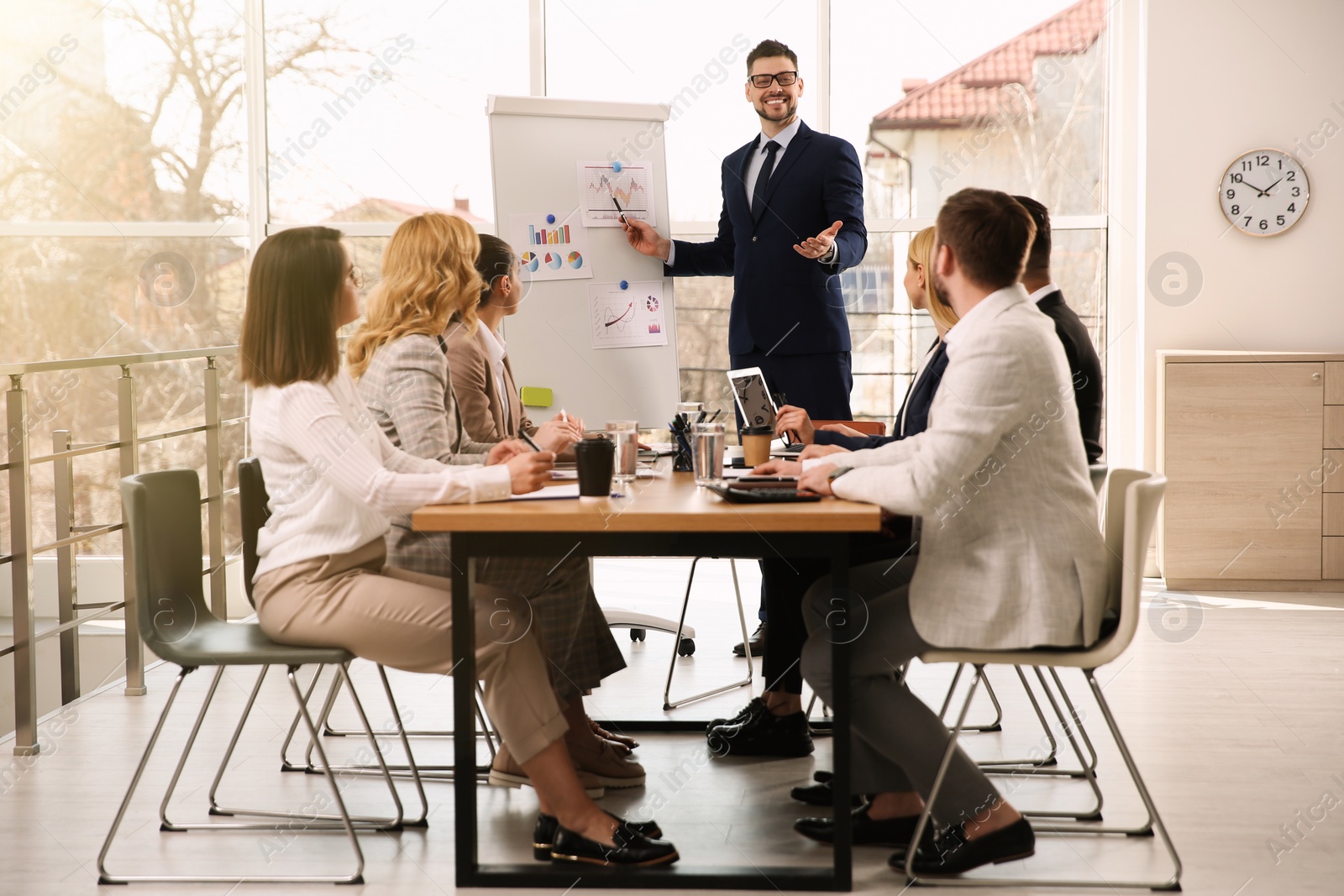 Businesspeople having meeting in office. Management consulting Photo of Businesspeople having meeting in office. Management consulting