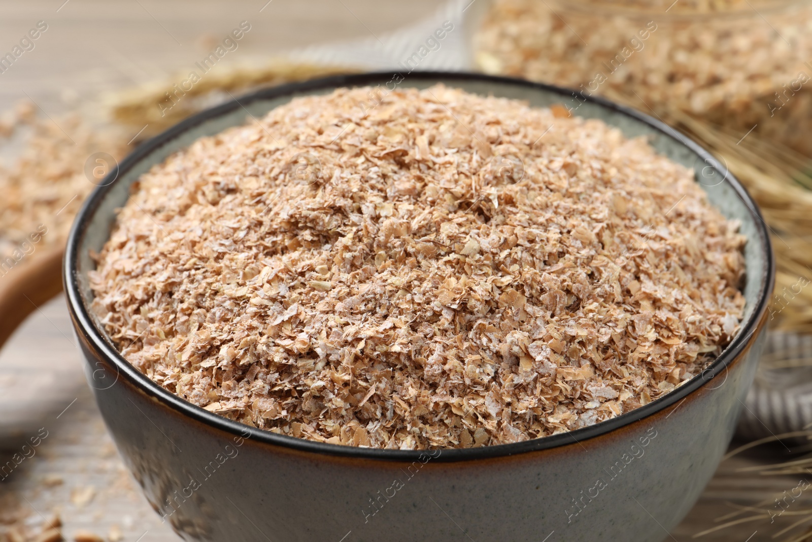 Dry wheat bran in bowl, closeup view Photo of Dry wheat bran in bowl, closeup view