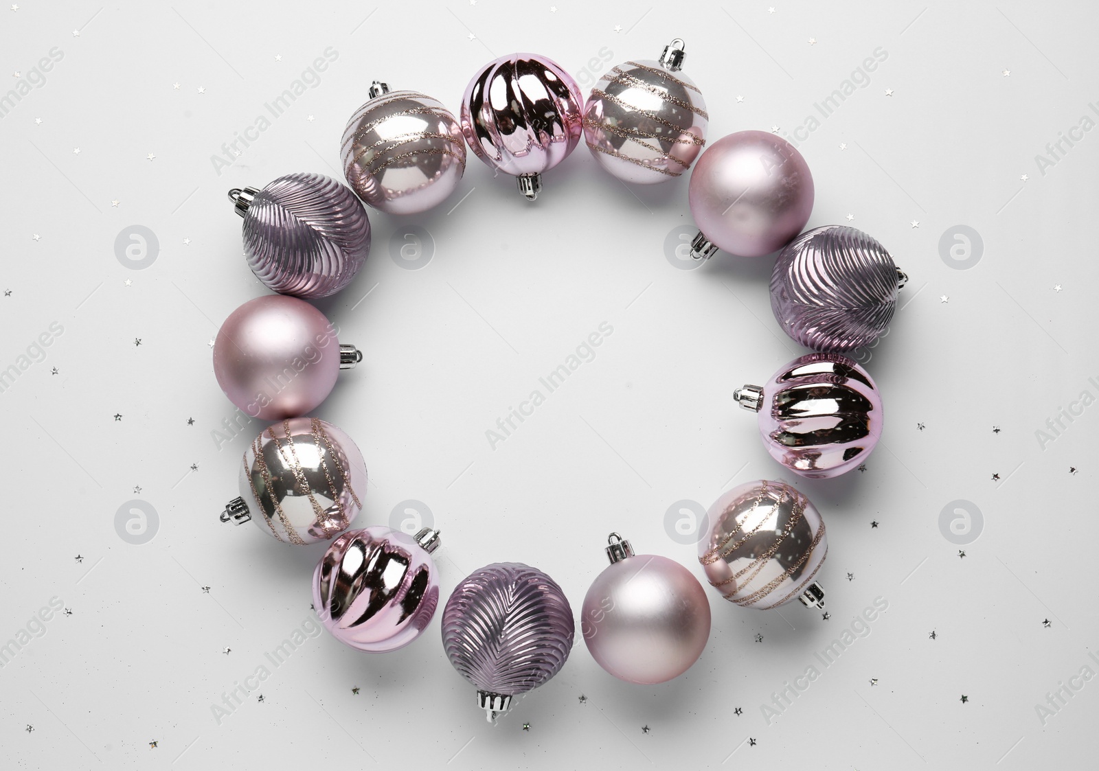 Beautiful festive wreath made of color Christmas balls on white background, top view Photo of Beautiful festive wreath made of color Christmas balls on white background, top view