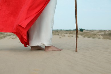 Jesus Christ walking in desert, closeup view Photo of Jesus Christ walking in desert, closeup view