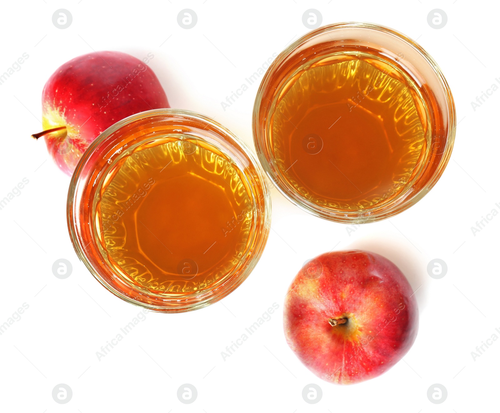 Glasses of juice and fresh apples on white background, top view Photo of Glasses of juice and fresh apples on white background, top view