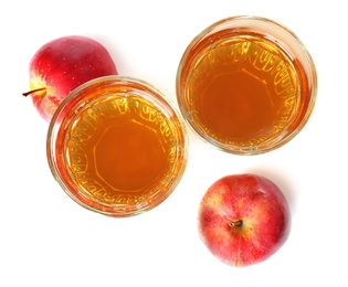 Glasses of juice and fresh apples on white background, top view Photo of Glasses of juice and fresh apples on white background, top view