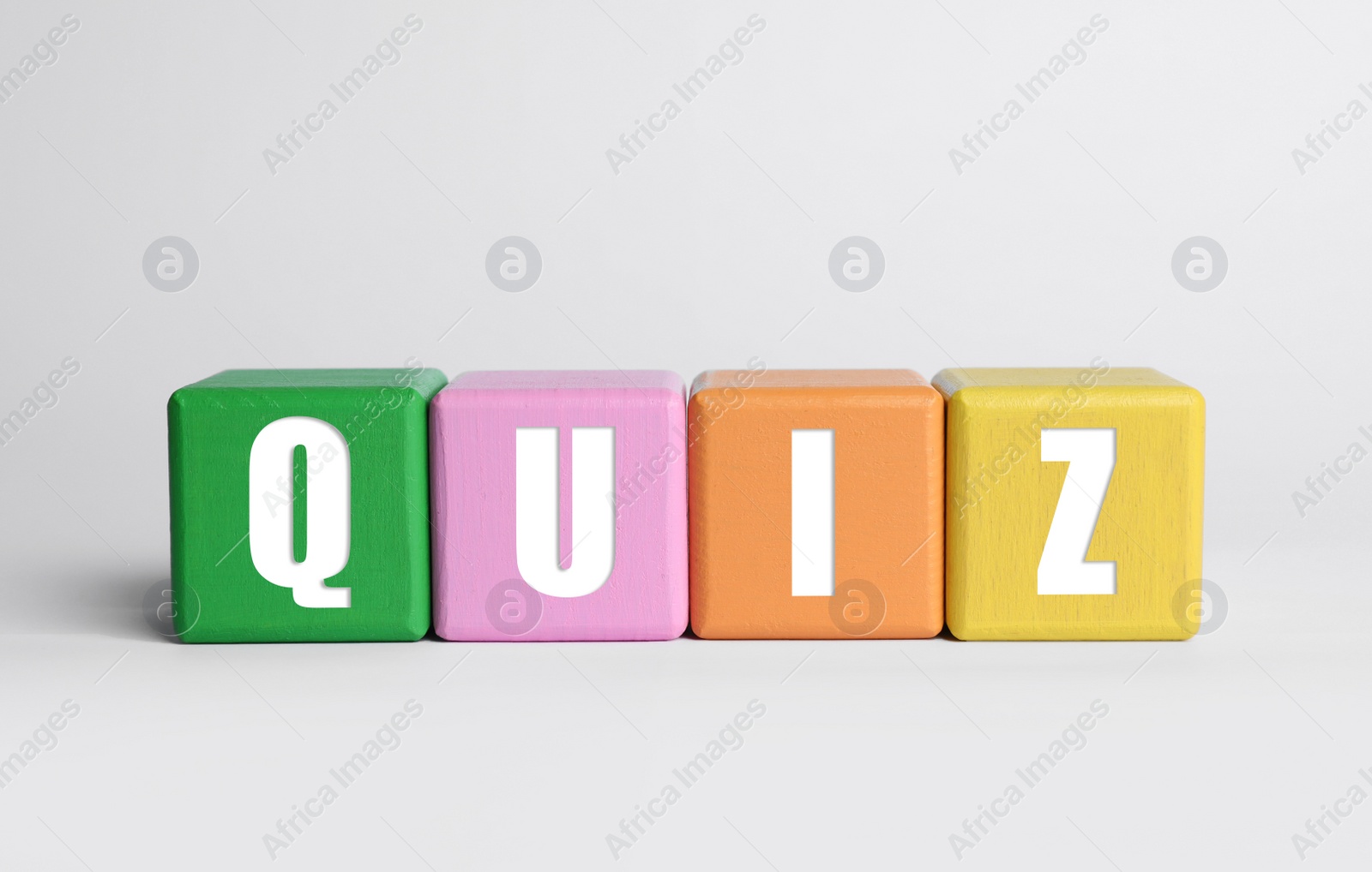 Colorful cubes with word Quiz on white background Photo of Colorful cubes with word Quiz on white background