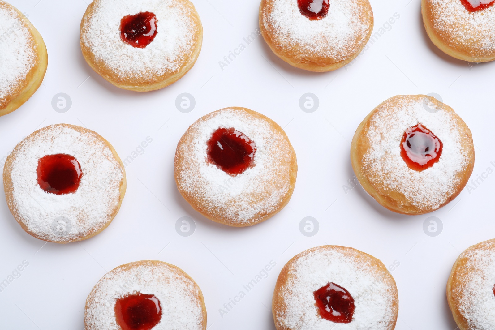 Hanukkah doughnuts with jelly and sugar powder on white background, top view Photo of Hanukkah doughnuts with jelly and sugar powder on white background, top view