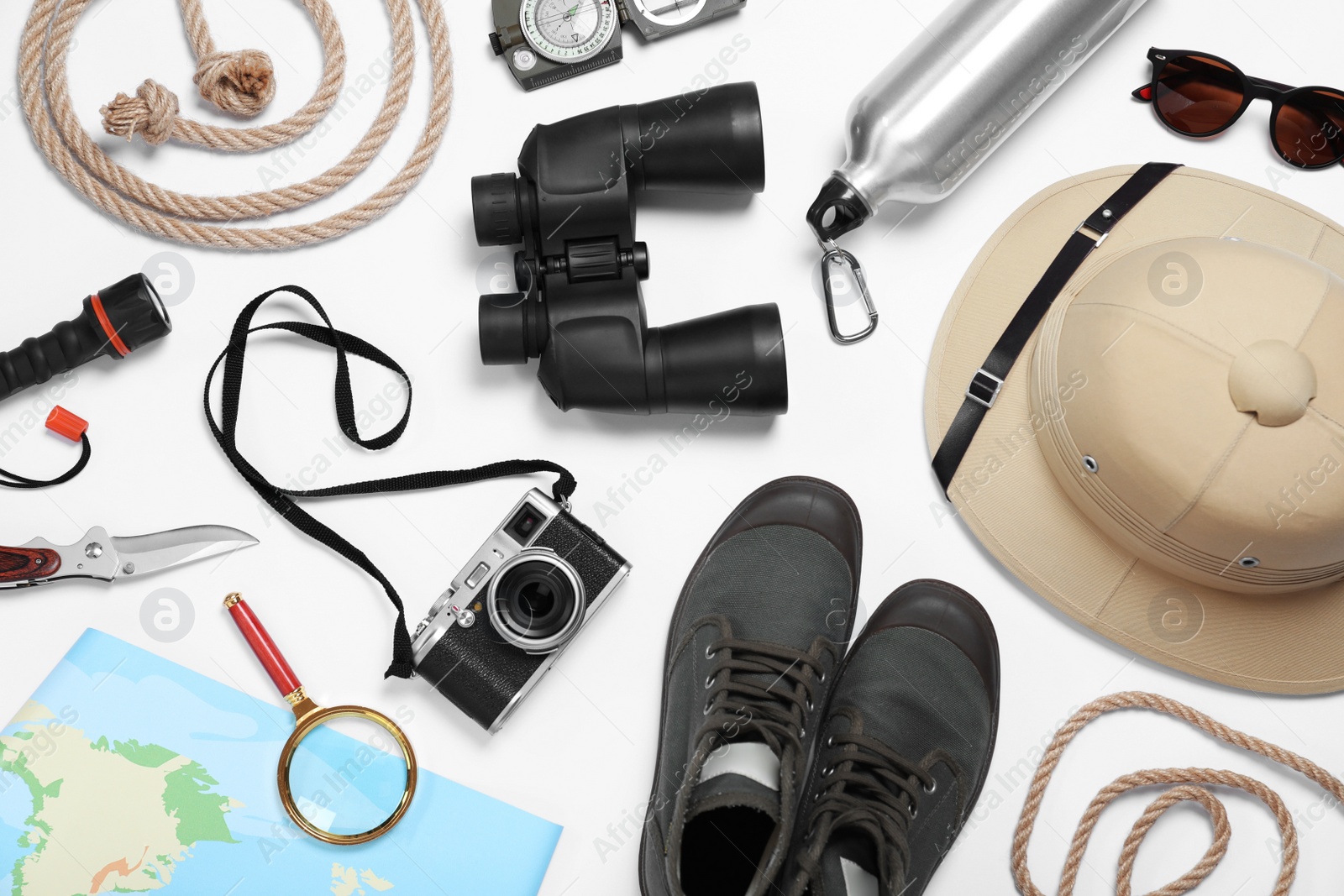 Flat lay composition with different safari accessories on white background Photo of Flat lay composition with different safari accessories on white background