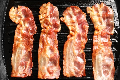 Grill pan with bacon, closeup Photo of Grill pan with bacon, closeup