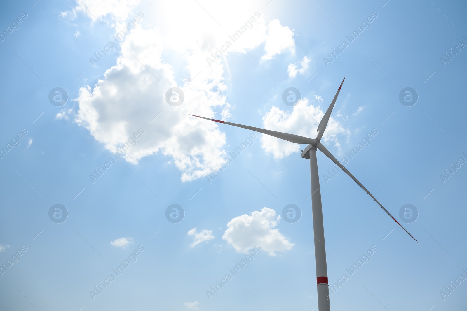Modern wind turbine against blue sky, low angle view. Energy efficiency Photo of Modern wind turbine against blue sky, low angle view. Energy efficiency