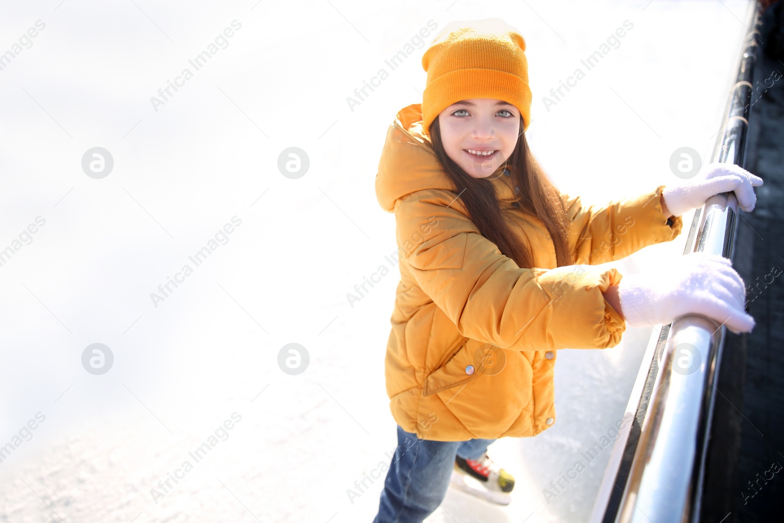 Cute little girl at outdoor ice skating rink Photo of Cute little girl at outdoor ice skating rink