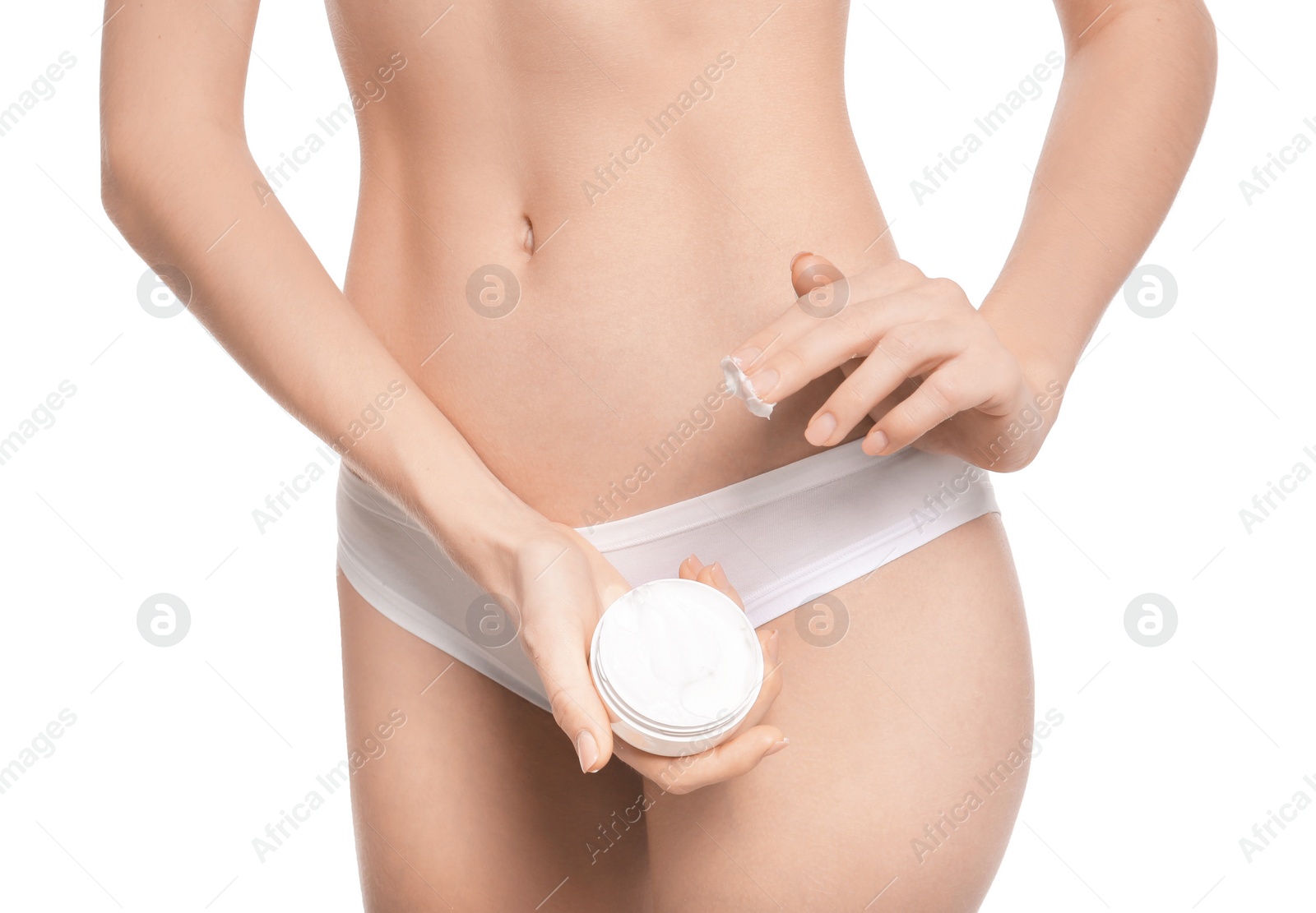 Young woman with jar of body cream on white background Photo of Young woman with jar of body cream on white background