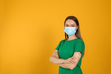 Vaccinated woman with protective mask and medical plaster on her arm against yellow background. Space for text Photo of Vaccinated woman with protective mask and medical plaster on her arm against yellow background. Space for text