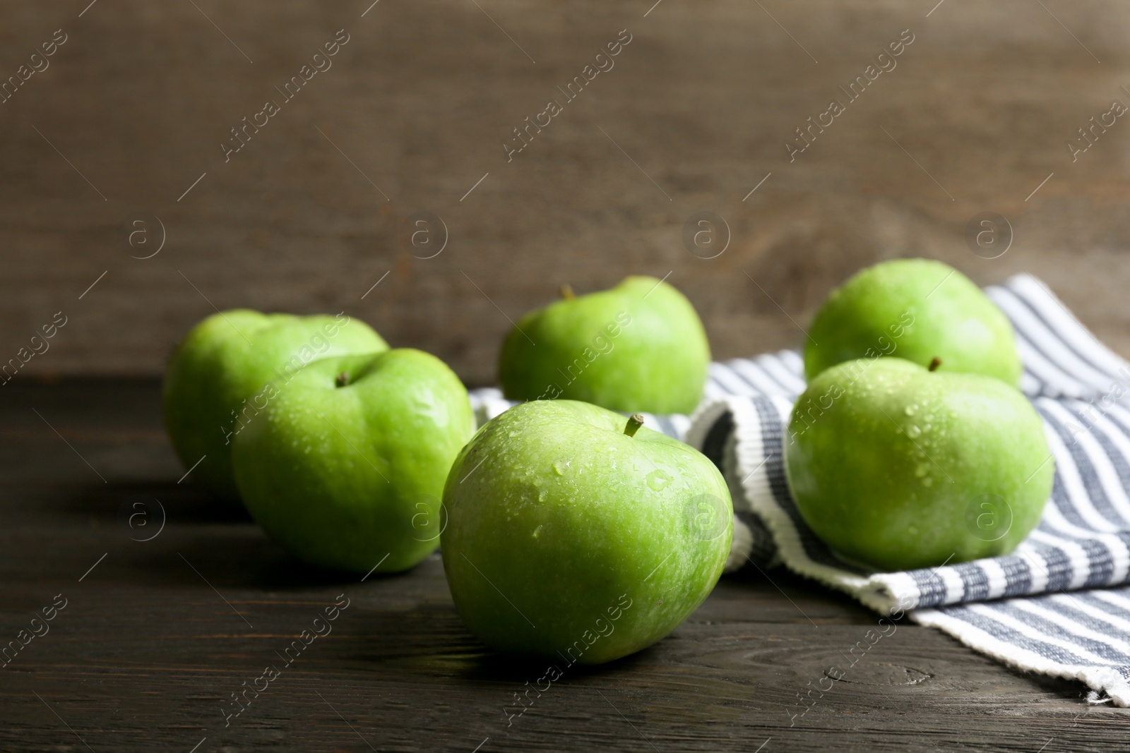 Fresh green apples on wooden table Photo of Fresh green apples on wooden table