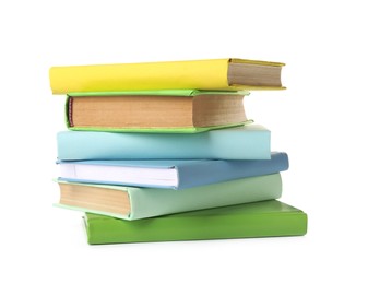Many colorful hardcover books on white background Photo of Many colorful hardcover books on white background