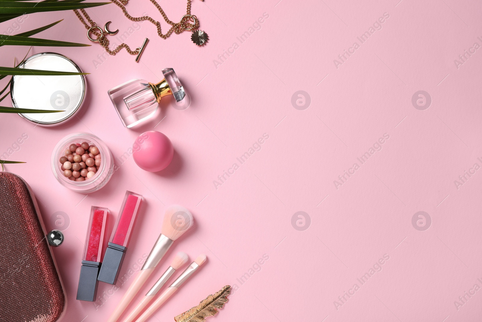 Flat lay composition with makeup products on pink background, space for text Photo of Flat lay composition with makeup products on pink background, space for text