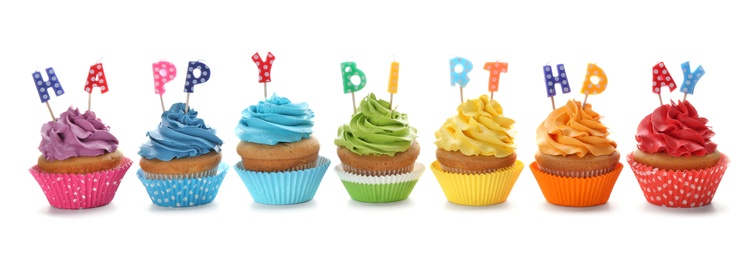 Birthday cupcakes with candles on white background Photo of Birthday cupcakes with candles on white background